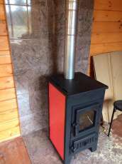 Купить стальной камин Везувий ПК-01 (270) в Пинске фото в интерьере в Пинске