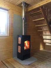 Популярный камин с дровницей Сибирь 8 в интерьере фото в Пинске