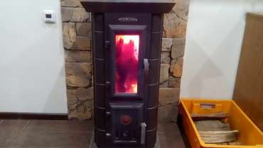 Стальная печь Термофор Статика Тетра, чёрная бронза фото в интерьере в Пинске