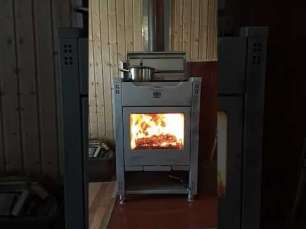 Стальной камин со стеклом Теплодар Кадриль фото в интерьере в Пинске