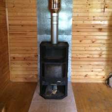 Печь-камин с шамотом Мета-Бел Ангара-Аква в интерьере фото в Пинске