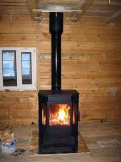 Печь-камин Бавария водяной с плитой в интерьере в Пинске