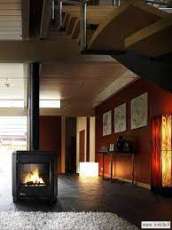 Печь-камин чугунный Invicta Carolo в интерьере Амазонка бай фото  в Пинске