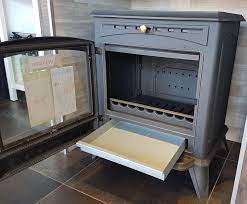 Печь-камин чугунный Invicta Altea в интерьере Амазонка бай фото в Пинске