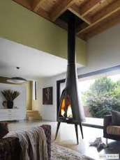 Печь-камин чугунный Invicta Pow-Wow в интерьере Амазонка бай фото в Пинске