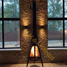 Печь-камин чугунный Invicta Pow-Wow в интерьере Амазонка бай фото в Пинске